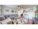 Spacious living room with hardwood floors and a neutral color palette at 821 Clarkson Ct, Denver, CO 80229