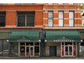 A commercial building exterior with office and residence spaces in a brick facade at 1555 California St # 609, Denver, CO 80202