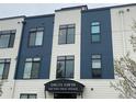 Modern building with clean lines and large windows, signage reads Logan Lofts 336 East First Avenue at 336 E 1St Ave # 310, Denver, CO 80203