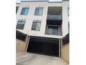 View of underground garage with black roller door, providing secure parking for the building residents at 336 E 1St Ave # 310, Denver, CO 80203