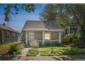 Charming home with a covered front porch and lovely front garden at 3968 Winona Ct, Denver, CO 80212
