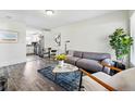 Inviting living room with modern furnishings and an open layout connecting to the kitchen at 2821 N Harrison St, Denver, CO 80205
