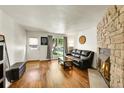 Cozy living room with fireplace and lots of light at 6765 S Independence St, Littleton, CO 80128