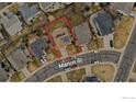 Aerial view of home with red boundary lines, solar panels, and a two-car driveway on Marion St at 16478 Marion St, Thornton, CO 80602