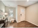 Inviting entryway featuring hardwood floors, a stylish console table, and a window for natural light at 5435 W 97Th Pl, Broomfield, CO 80020