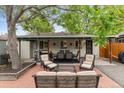Inviting outdoor patio with ample seating, ideal for relaxing and entertaining guests at 2967 Olive St, Denver, CO 80207
