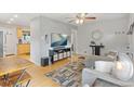 Cozy living room featuring stylish decor, hardwood floors, and natural light at 2967 Olive St, Denver, CO 80207