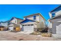 Attached garage with white door and stone base at 868 N Quatar St, Aurora, CO 80018