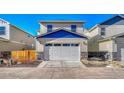 Attached garage with white door and stone base at 868 N Quatar St, Aurora, CO 80018