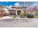 Charming two-story home with landscaped yard, a covered entryway, and an attached two-car garage at 2616 E Cherry Creek South Dr, Denver, CO 80209