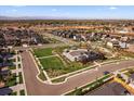Expansive aerial view of a well-maintained neighborhood with a community park and mountain views at 672 W 128Th Pl, Westminster, CO 80234