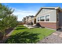 Spacious backyard showcasing a patio, perfect for outdoor dining and relaxation in a private setting at 672 W 128Th Pl, Westminster, CO 80234