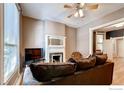 Inviting living room with a decorative fireplace, comfortable couch, and natural light at 1767 N Washington St, Denver, CO 80203
