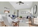 Bright living room featuring vaulted ceiling, hardwood floors, and modern decor at 12961 Lafayette St # B, Thornton, CO 80241