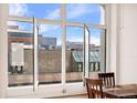 Large windows provide an airy feel and urban view to this home at 1617 California St # 3B, Denver, CO 80202