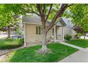 Charming home featuring a well-maintained lawn and an inviting entrance with mature trees at 1385 W 112Th Ave # D, Denver, CO 80234