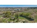 Landscaped property featuring ponds and mature trees, conveniently located near industrial buildings and residential areas at 16440 Old Denver Rd, Monument, CO 80132