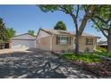 This property offers a detached two-car garage, and a nicely landscaped yard with a sprinkler system at 1229 W 102Nd Ave, Northglenn, CO 80260