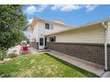 Exterior of the home with landscaping and walkway at 7309 W Hampden Ave # 402, Lakewood, CO 80227