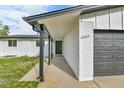 Close-up showcasing a charming home's entrance, address, and attached two-car garage at 5224 Scranton Ct, Denver, CO 80239