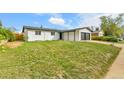Charming single-story home featuring a two-car garage and well-maintained front lawn at 5224 Scranton Ct, Denver, CO 80239