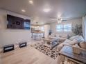 Inviting living room with an open floor plan and modern finishes at 10948 Murray Dr, Northglenn, CO 80233