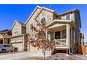 Charming two-story home with a covered front porch, well-maintained landscaping, and a two-car garage in a modern neighborhood at 723 176Th Ave, Broomfield, CO 80023