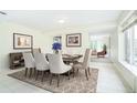 Dining room features a stylish rug under an elegant table with seating for eight at 4605 S Yosemite St # 301, Denver, CO 80237