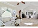 Elegant dining area with large windows, vaulted ceilings, and stylish chairs, ideal for hosting gatherings at 19431 E Hamilton Pl, Aurora, CO 80013