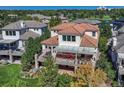 Elegant home with an expansive balcony, perfect for outdoor entertaining, overlooking garden at 9316 E Harvard Ave, Denver, CO 80231