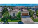 Beautiful home featuring lush landscaping, a tile roof, and a well-maintained lawn at 9316 E Harvard Ave, Denver, CO 80231