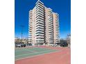 A stunning view of a high rise condo building featuring continuous balconies, near the community tennis courts at 130 N Pearl St # 808, Denver, CO 80203