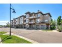 Modern townhome building with attached garages and balconies at 16700 Las Ramblas Ln # O, Parker, CO 80134