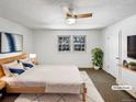 Virtually staged main bedroom with ceiling fan and ample natural light at 3850 Paseo Del Prado # 7, Boulder, CO 80301