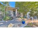 Inviting front porch with stone accents, landscaped garden, and seating area, perfect for relaxing at 4285 Corte Bella Dr, Broomfield, CO 80023