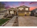 Charming two-story home with a well-maintained front yard and a three car garage at 6173 Eldora St, Golden, CO 80403