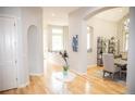 Hallway with hardwood floors, and decoratively painted neutral-colored walls at 226 Hidden Valley Ln, Castle Rock, CO 80108