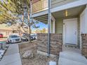 Front entrance with brick wall and walkway at 932 S Dearborn Way # 8, Aurora, CO 80012