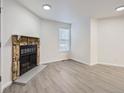 Living room with fireplace and light flooring at 932 S Dearborn Way # 8, Aurora, CO 80012