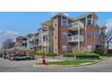 Inviting brick condo building featuring balconies and well-maintained landscaping at 2428 W 82Nd Pl # 3A, Westminster, CO 80031
