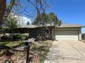 Well-kept single Gathering home with a two-car garage and a cozy, inviting front yard at 12831 E Mexico Ave, Aurora, CO 80012