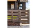 Horizontal wooden gate with house number at 3250 N Clayton St, Denver, CO 80205