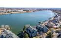 Stunning aerial view of lakeside homes with private boat docks and beautiful lake views at 6840 Xavier Cir # 5, Westminster, CO 80030
