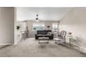 Spacious living room with plenty of natural light, comfortable seating, and modern decor at 6840 Xavier Cir # 5, Westminster, CO 80030