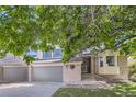 Charming two-story home with a well-maintained yard, a three-car garage, and an inviting front entrance at 2552 E 126Th Way, Thornton, CO 80241