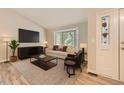 Bright living room with bay window, modern decor and neutral color palette at 2552 E 126Th Way, Thornton, CO 80241