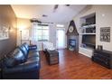 Comfortable living room with a fireplace, vaulted ceilings, and ample natural light. Stylish furnishings at 8481 W Union Ave # 2-201, Littleton, CO 80123
