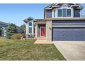 Charming home with a well-manicured lawn, and a three-car garage at 16442 Bluebonnet Dr, Parker, CO 80134