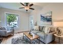 Comfortable living room with natural light, neutral tones, and stylish furnishings at 2562 N Emerson St, Denver, CO 80205