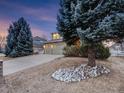 Two-story home with an oversized driveway and a neatly manicured lawn at 14497 Jason Dr, Westminster, CO 80023